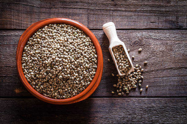 istock Brown bowl filled with hemp seeds shot from above on rustic wooden table 835875094