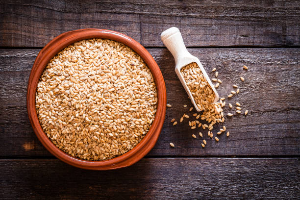 istock Brown bowl filled wit flax seeds shot from above on rustic wooden table 835875274