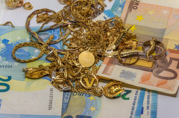 istock gold and euro bills 835875754