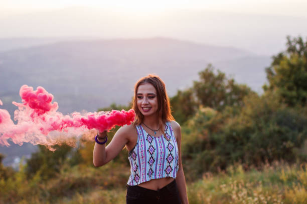 istock Girl in a red smoke cloud 835875836