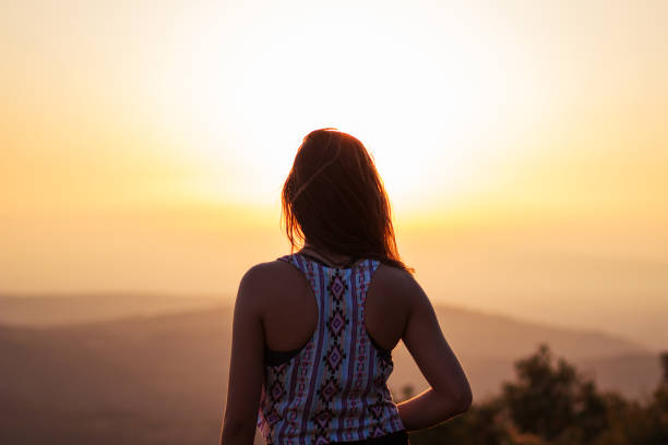 istock Young beautiful girl watching sunset 835876056
