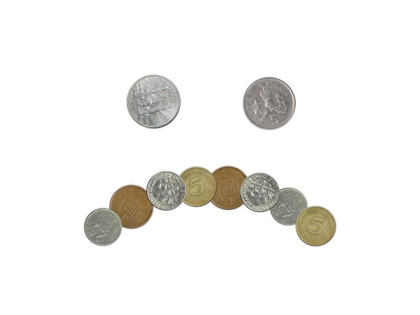 istock Sad  face emoji with old coins on white background 835876502