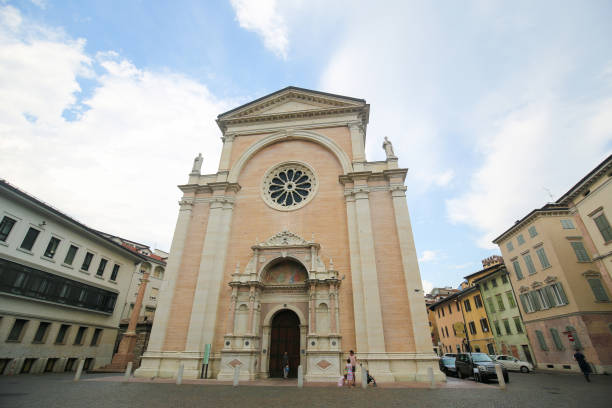 Unidentified people near the Church of Santa Maria Maggiore, an important place of worship in the city of Trento, and the site of the Council of Trent.