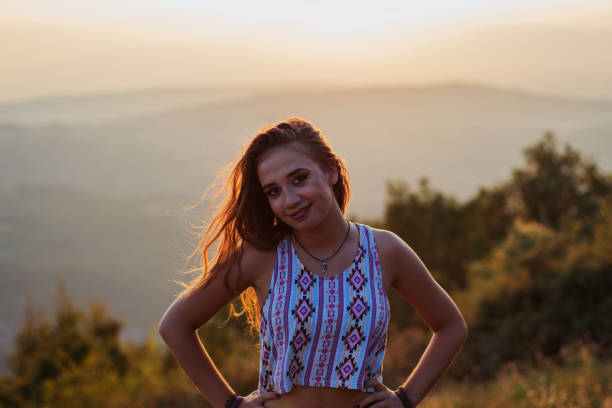 istock Young beautiful girl watching sunset 835879104