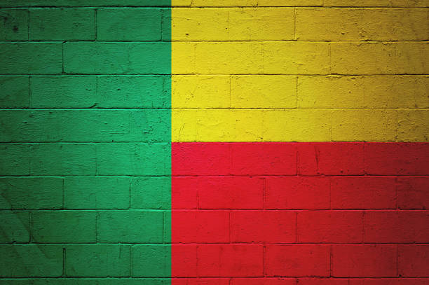 Flag of Benin painted on a brick wall.