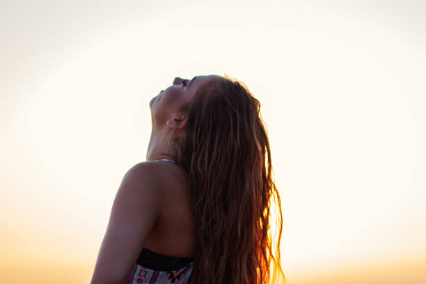 istock Young beautiful girl watching sunset 835882258