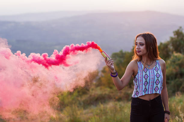 istock Girl in a red smoke cloud 835885038
