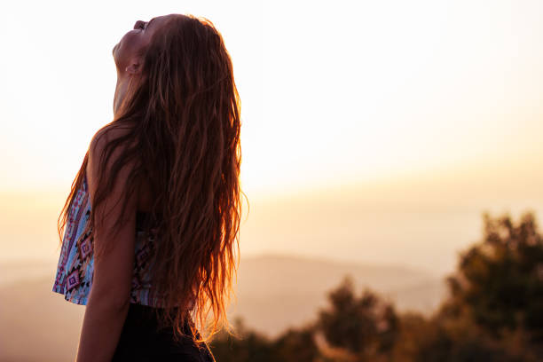 istock Young beautiful girl watching sunset 835885842