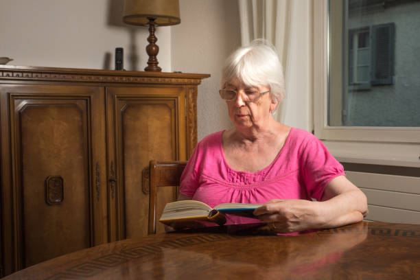 istock Woman reading something in a book 835889324