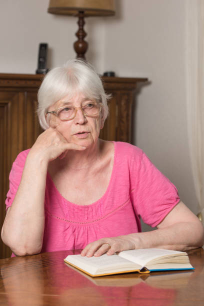 istock Woman reading something in a book 835889444