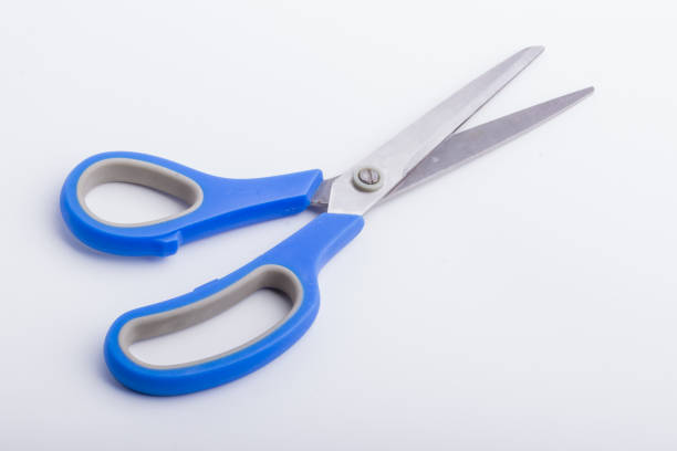 istock A half open pair of scissors with a blue grip 835896398