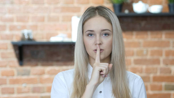 istock Silent, Young Woman Showing Gesture of Silence 835897662