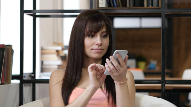 istock Woman Using Smartphone, Indoor Office 835900874