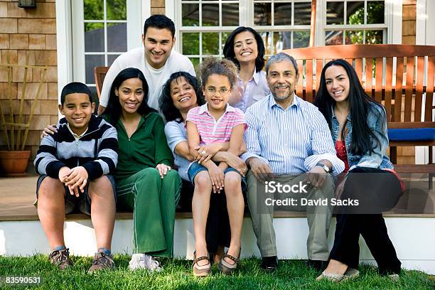 Multigenerational Familia Hispana En Porche Foto de stock y más banco de imágenes de Familia - Familia, Familia multigeneracional, Etnia Latinoamericana