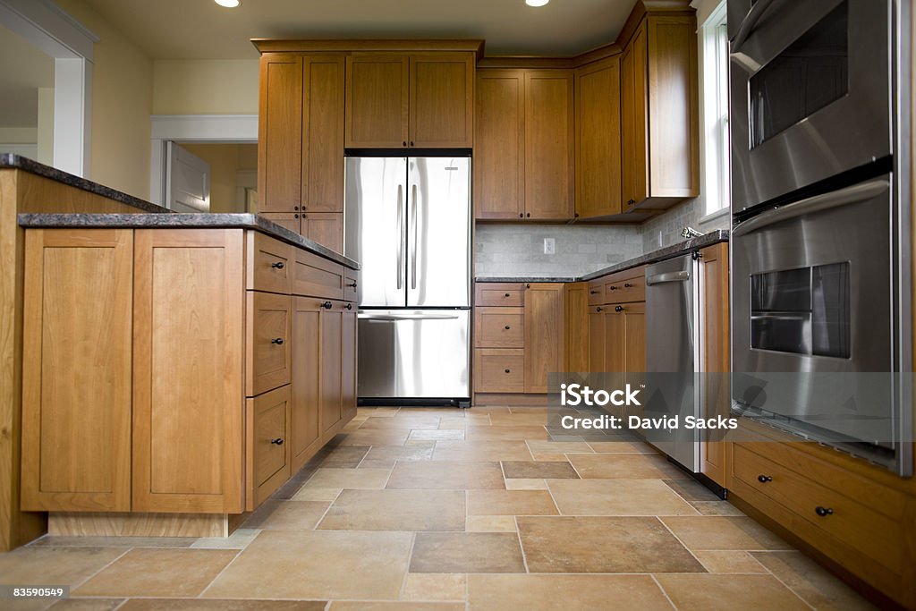 Kitchen in newly constructed house  Tiled Floor Stock Photo
