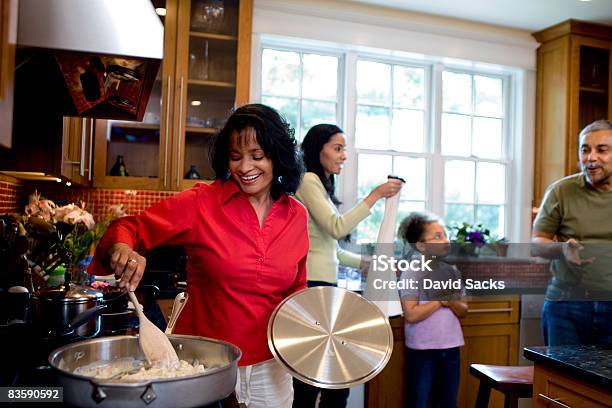 Multigenerational Family Together In Kitchen Stock Photo - Download Image Now - Family, Cooking, Multi-Generation Family