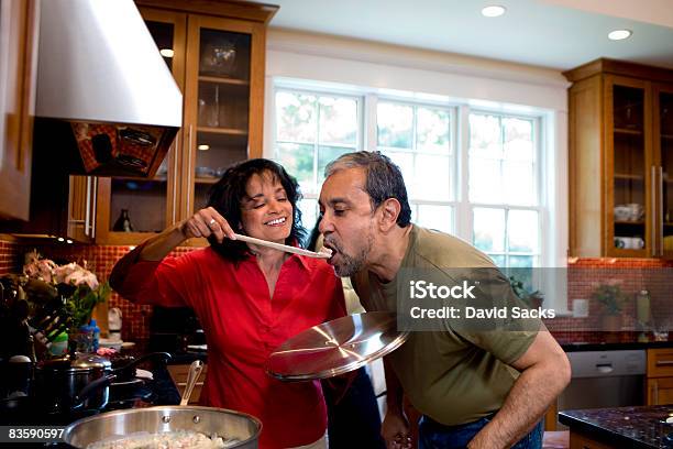 Mature Couple Cooking Together Stock Photo - Download Image Now - Cooking, Latin American and Hispanic Ethnicity, Mature Couple