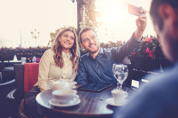 istock Happy Smiling Couple Taking Selfie in a Cafe Restaurant 835907120