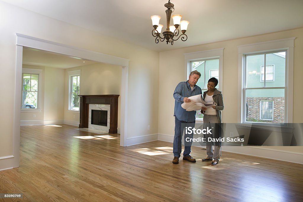 Contractor discussing renovations   Examining Stock Photo