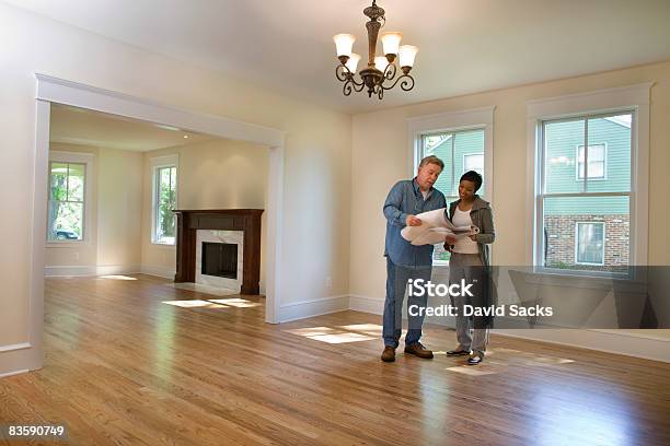 Contractor Discussing Renovations Stock Photo - Download Image Now - Examining, Building Contractor, Home Ownership