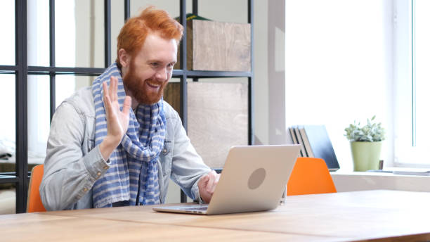 istock Beard Man Online Video Chat on Laptop 835909360