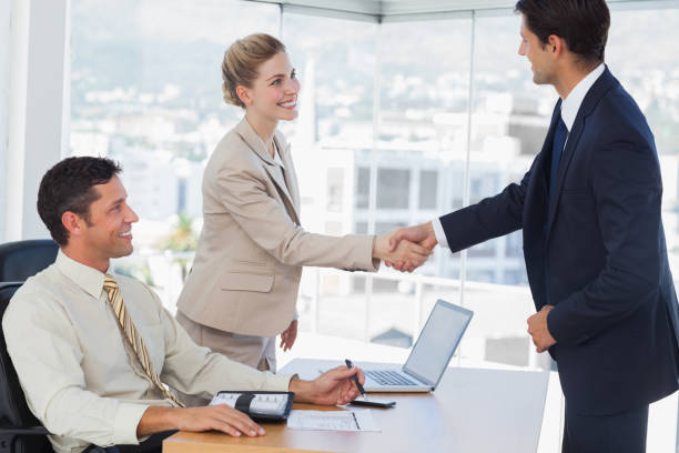 istock Business people shaking hands with their future patner 835909596