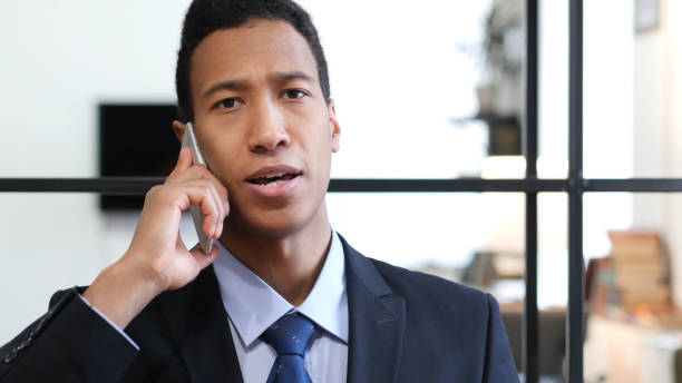 istock Phone Talk, Black Businessman Attending Call at Work 835909998