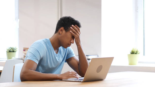 istock Headache, Tired Young Black Man Working on Laptop 835910278