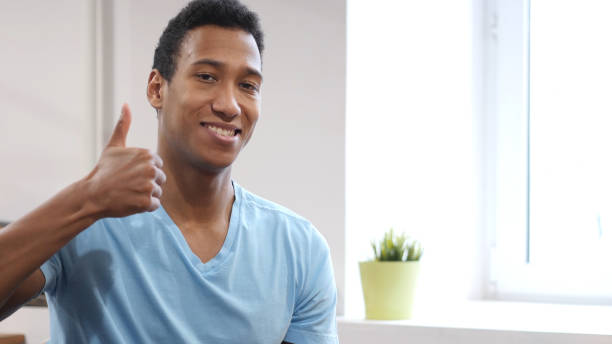 istock Thumbs Up by Young Black Man 835910300