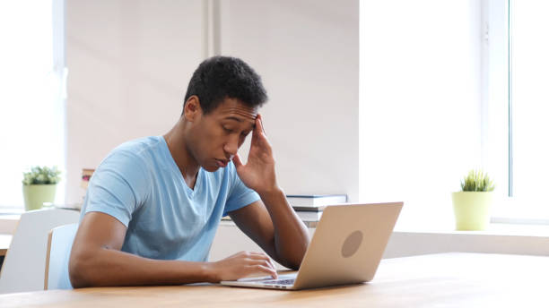 istock Tired Young Black Man Working on Laptop 835910320