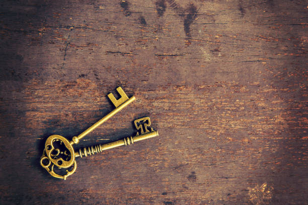 istock old key on wood background with space 835919370