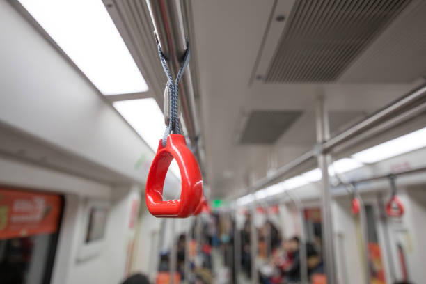 Orange handles in subway train