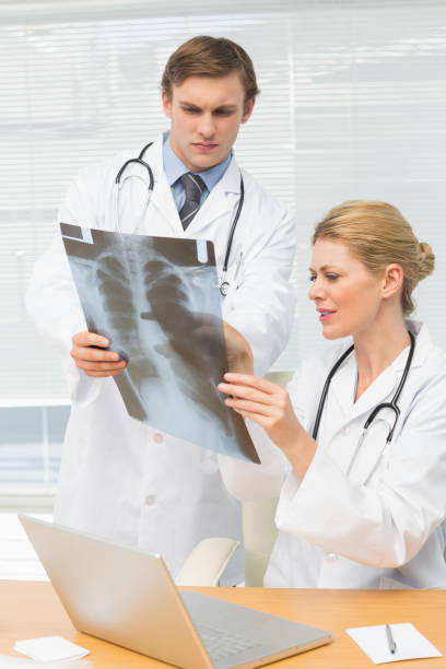 istock Doctors examining an xray together 835925992