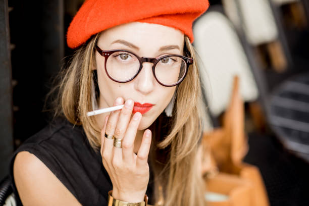 istock French woman smoking at the cafe 835926210