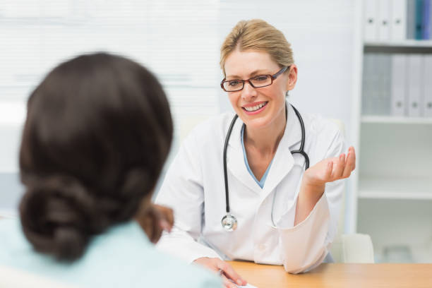 istock Smiling doctor talking to her patient 835926282
