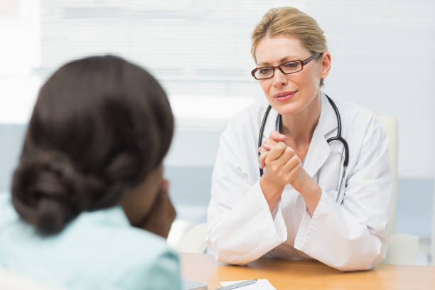 istock Concerned doctor listening to her patient 835926304
