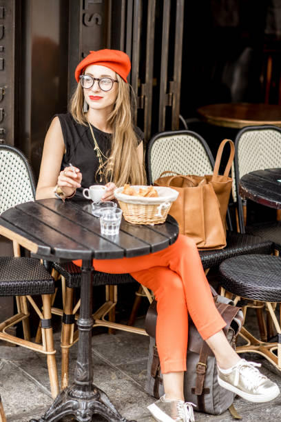istock French woman smoking at the cafe 835926436