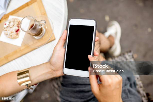 Using A Smartphone At The Cafe Stock Photo - Download Image Now - Telephone, Template, Women