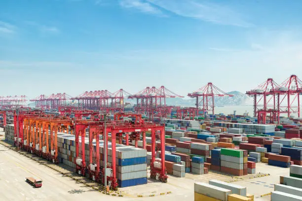 Industrial port with containers, Shanghai Yangshan deepwater port is a deep water port for container ships in Shanghai, China.