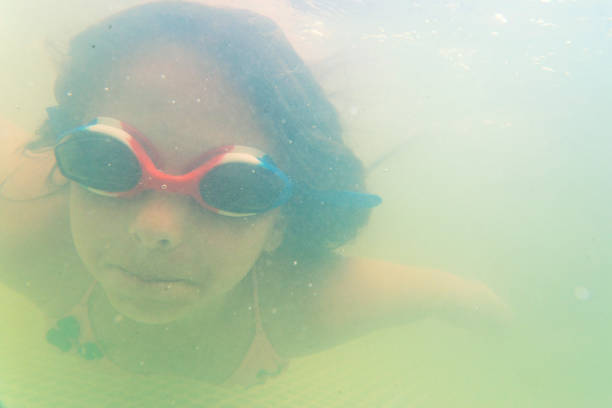 Swimming children in the pool.