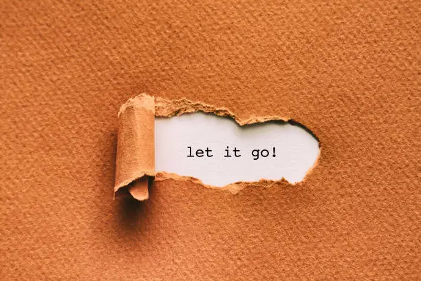 Let it go written under torn paper.
