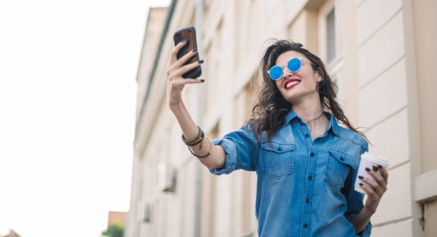 istock Woman making selfie outdoors 835940634