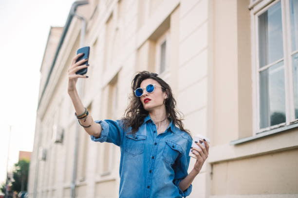 istock Young woman making selfie 835940770