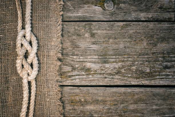 ship rope on old wood and burlap texture background with copy space - wood yacht textured nautical vessel imagens e fotografias de stock