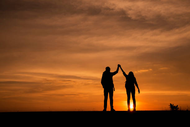 istock Silhouette of two couple (backpacker) 835943268