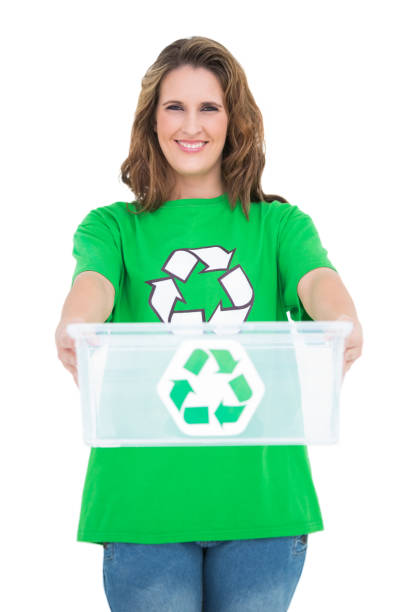 istock Smiling activist holding recycling box 835943428
