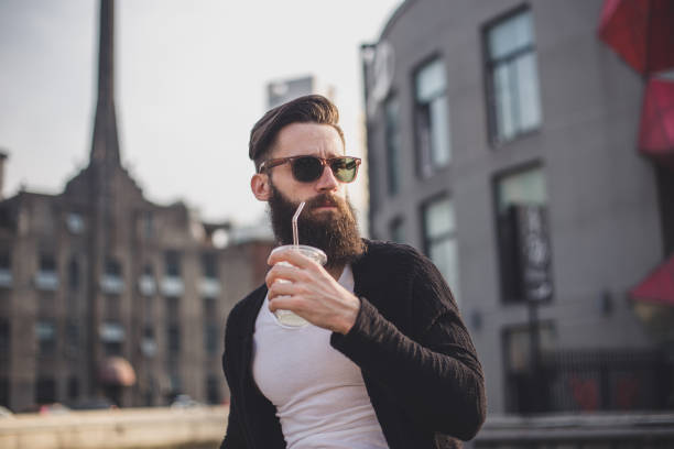 istock Handsome hipster man with cup of juice 835943784