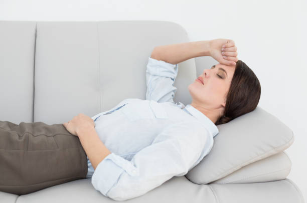 istock Well dressed young woman resting on sofa 835946618