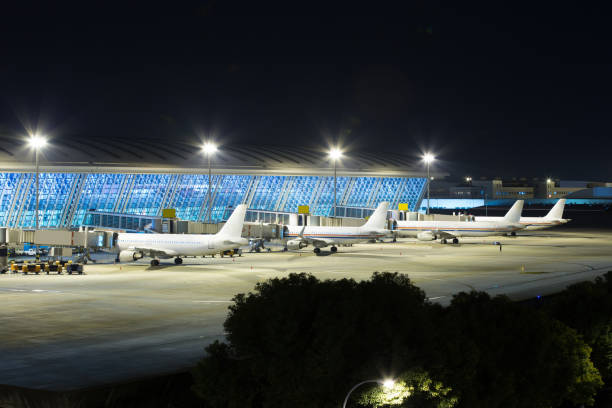 istock Airport with many airplanes at beautiful sunset 835949534
