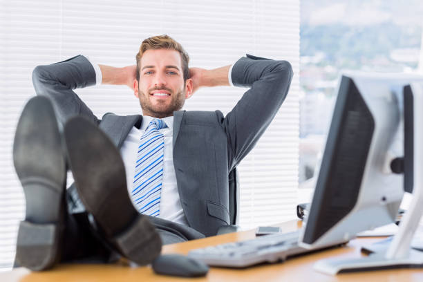 istock Relaxed businessman sitting with legs on desk 835950008